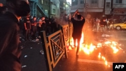 A picture obtained by AFP outside Iran on Sept. 21, 2022, shows Iranian demonstrators taking to the streets of Tehran to protest the death of Mahsa Amini, who died after being arrested by the country's morality police.