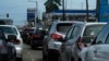 FILE - Cars line up outside a petrol station in Lagos, Nigeria, June 22, 2022. 