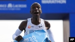 FILE - Kenya's Eliud Kipchoge crosses the line to win the Berlin Marathon in Berlin, Germany, Sept. 25, 2022.