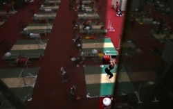 In this July 20, 2021, file photo, an athlete trains at the weightlifting training hall at the 2020 Summer Olympics, Tuesday, July 20, 2021, in Tokyo. (AP Photo/Petr David Josek, File)