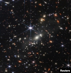 The first full-color image released by NASA from the James Webb Space Telescope shows the galaxy cluster SMACS 0723, in a composite made from images at different wavelengths taken with a Near-Infrared Camera and released July 11, 2022. (Image Credit: NAS