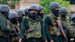Army soldiers stand guard following an eviction of protesters from the Presidential Secretariat in Colombo, Sri Lanka, July 22, 2022.