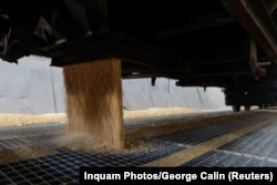Corn is unloaded from a Romanian train at the grain terminal in Constanta harbor, in Constanta, Romania, Aug. 1, 2022.