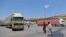 FILE - A convoy transporting humanitarian aid crosses into Syria from Turkey through the Bab al-Hawa border crossing on July 8, 2022. 