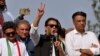 Pakistan’s former Prime Minister Imran Khan, center, speaks during a rally in Islamabad, May 26, 2022. 
