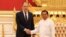 Russian Foreign Minister Sergei Lavrov (R) shakes hands with Myanmar Min Aung Hlaing, Senior General and Chairman of the State Administration Council in Naypyidaw, on August 3, 2022. (Photo by HANDOUT / RUSSIAN FOREIGN MINISTRY / AFP)