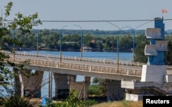 The Antonivskyi bridge is closed to civilians after it reportedly came under fire during the Ukraine-Russia conflict in the Russian-controlled city of Kherson, Ukraine July 27, 2022.