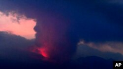 This long exposure image shows the eruption of volcano Sakurajima Sunday night, July 24, 2022, in the view from Tarumizu city, Japan's southern prefecture of Kagoshima. Japan’s Meteorological Agency said a volcano on Japan’s southern main island of Kyushu