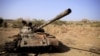 FILE - A destroyed tank is seen in a field in the aftermath of fighting between the Ethiopian National Defence Force and the Tigray People's Liberation Front (TPLF) forces in Kasagita town, in Afar region, Ethiopia, Feb. 25, 2022. 