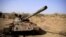 FILE - A destroyed tank is seen in a field in the aftermath of fighting between the Ethiopian National Defence Force and the Tigray People's Liberation Front (TPLF) forces in Kasagita town, in Afar region, Ethiopia, Feb. 25, 2022. 