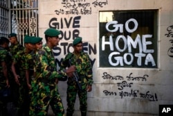 Sri Lanka army soldiers patrol near the official residence of president Gotabaya Rajapaksa three days after it was stormed by anti-government protesters in Colombo in Colombo, July 12, 2022.