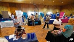 FILE - Veterans and job seekers were invited to attend the 2022 Mississippi Re-Entry Job Fair in Jackson, Miss., on June 22, 2022.