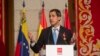 FILE - The leader of Venezuela's political opposition Juan Guaido makes a speech at the Madrid regional government building during a visit to Madrid, Spain, Jan. 25, 2020. 