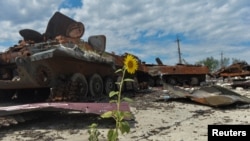 Destroyed Russian military vehicles are seen at a compound of an agricultural farm, which was used by Russian troops as a military base during Russia's attack on Ukraine, in Kharkiv Region, Ukraine, July 17, 2022.