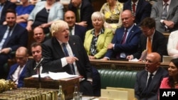 A handout photograph released by the U.K. Parliament shows Britain's Prime Minister Boris Johnson speaking during his final Prime Minister's Questions at the House of Commons in London on July 20, 2022.
