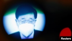 Hong Kong Chief Executive John Lee speaks during a news conference about the shortened COVID-19 quarantine period, in Hong Kong, China August 8, 2022.