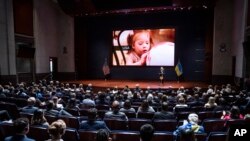 Olena Zelenska, the first lady of Ukraine, introduces members of Congress to a young victim of a Russian bombing during her address on Capitol Hill in Washington, July 20, 2022.