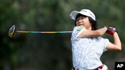 Miroku Suto, of Japan, watches her tee shot on the 16th hole during the final round at the Junior World Championships golf tournament at Singing Hills Golf Resort on July 14, 2022, in El Cajon, Calif.