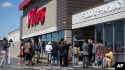 Select members of the community, employees and media take a tour of the renovated Tops Friendly Market, July 14, 2022, in Buffalo, New York.
