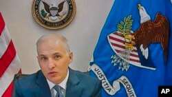 FILE - Assistant Attorney General for National Security Division Matthew Olsen, seen from a video monitor, testifies remotely before the Senate Judiciary Committee during a Feb. 10, 2022, virtual hearing about domestic terrorism after the Jan. 6 Capitol riot.