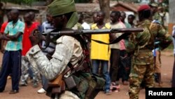 A Chadian soldier holds his weapon in Bangui, Central African Republic, Dec. 9, 2013.