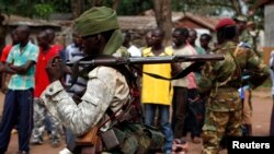 A Chad soldier holds his weapon in Bangui, Central African Republic, Dec. 9, 2013.