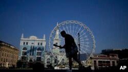 A street musician performs in Kyiv, Ukraine, June 10, 2022. 