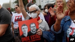 Demonstrators take part in a protest following the disappearance, in the Amazon, of British journalist Dom Phillips and expert on indigenous affairs Bruno Araujo Pereira, at Copacabana beach, Rio de Janeiro, Brazil, June 12, 2022. 