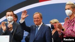 Christian Democratic Union (CDU) leader and top candidate for chancellor Armin Laschet appears after first exit polls for the general elections in Berlin, Germany, Sept. 26, 2021. 