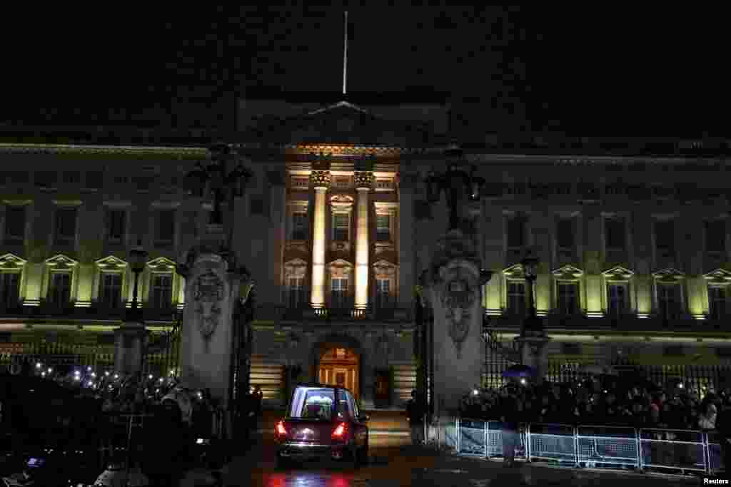 The hearse carrying the coffin of Queen Elizabeth arrives at Buckingham Palace, following her death, in London, Sept. 13, 2022.