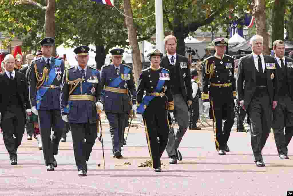 From left, the Earl of Snowden, Prince William, King Charles III, the Duke of Gloucester, Princess Anne, Prince Harry, Tim Laurence, Prince Andrew, and Peter Phillips follow the coffin of Queen Elizabeth II.