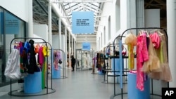 Creations, part of the 'We Are Made in Italy' fashion event, are shown during the women's Spring Summer 2023 fashion week, in Milan, Italy, Sept. 21, 2022.