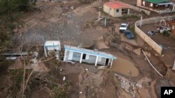 Sebuah rumah tertimbun lumpur setelah tersapu oleh Badai Fiona di Villa Esperanza di Salinas, Puerto Rico, Rabu, 21 September 2022.