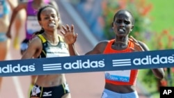 FILE - Runners are seen at the ADIDAS Grand Prix at Icahn Stadium on Randalls Island in New York, June 12, 2010.