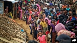 Rohingya Muslims, who from Myanmar into Bangladesh, wait in queues to receive aid at Kutupalong refugee camp in Ukhiya, Bangladesh, Nov. 15, 2017. Secretary of State Rex Tillerson called for an independent investigation into a humanitarian crisis in which hundreds of thousands of Muslim Rohingya have fled to Bangladesh.