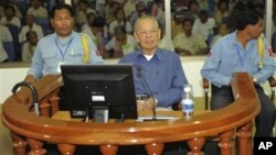 Ieng Sary, center, former Khmer Rouge's foreign affair minister, sits in a court dock of the U.N.-backed genocide tribunal, during a hearing Friday, April 30, 2010, in Phnom Penh.