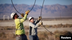 Linemen repair lines that were broken during a powerful earthquake that struck Southern California, near the epicenter, northeast the city of Ridgecrest, California, July 4, 2019.