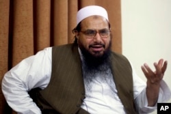 FILE - Hafiz Mohammed Saeed, founder of Lashkar-e-Taiba, talks with the Associated Press in Islamabad, Pakistan, April 3, 2012.