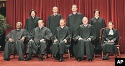 FILE - The justices of the U.S. Supreme Court gather for a group portrait at the Supreme Court in Washington, October 2010.