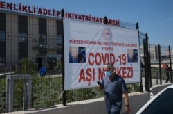A man arrives to get a dose of Pfizer COVID-19 vaccine at a hospital, in Ankara, Turkey, May 1, 2021.