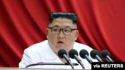 North Korean leader Kim Jong Un speaks during the 5th Plenary Meeting of the 7th Central Committee of the Workers' Party of Korea in this undated photo released on Dec. 30, 2019.