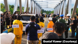 Rekonstruksi kasus pembunuhan dan mutilasi di Mimika, Timika, Papua digelar Sabtu (3/9). (Foto: Courtesy/Gustaf Kawer)
