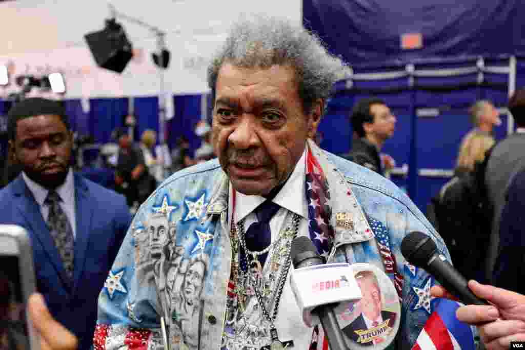 Trump supporter and boxing promoter Don King talks to reporters in "Spin Alley" following the debate.