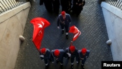 FILE - Members of the Order of the Knights of Malta arrive in St. Peter's Basilica for their 900th anniversary at the Vatican, Feb. 9, 2013.