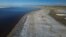 Record-low water levels are seen at the Great Salt Lake, Sept. 6, 2022, near Salt Lake City. A heat wave is breaking records in Utah, where temperatures hit 105 degrees F (40.5 C) on Tuesday. Heat waves are among the many environmental challenges facing the planet.