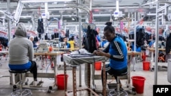 FILE - Women operate sewing machines in a garment factory at the Hawassa Industrial Park, in Hawassa, southern Ethiopia, October 1, 2019.