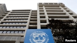 FILE - The International Monetary Fund headquarters building in Washington, U.S., April 8, 2019. 