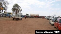 FILE - Motorists queue for fuel at a pump station in Malawi, in this 2022 file photo. Hours-long lines are hitting the country again in July 2023 as a fuel shortage strikes nationwide.