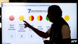 FILE - IAEA Chief Rafael Grossi explains a graph as he speaks to the press after the return an IAEA team from the Russian-held Zaporizhzhia nuclear power plant in southern Ukraine, at Vienna International Airport in Schwechat, Austria, Sept. 2, 2022.