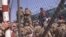 FILE - U.S. Marines are seen at Abbey Gate before a suicide bomber struck outside Hamid Karzai International Airport in Kabul, Afghanistan, Aug. 26, 2021, in this image from a video released by the Department of Defense.